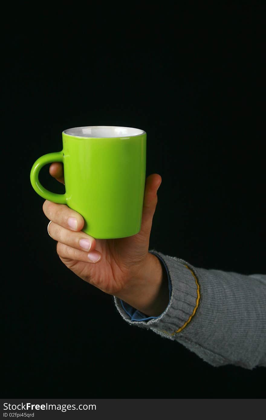 An image of a charismatic man drinking tea. An image of a charismatic man drinking tea