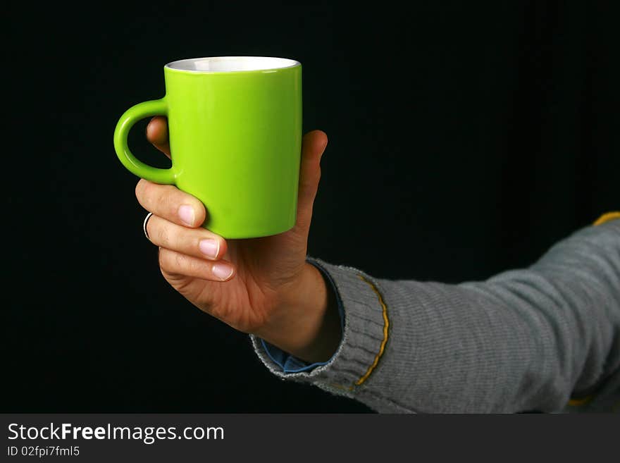 An image of a charismatic man drinking tea. An image of a charismatic man drinking tea