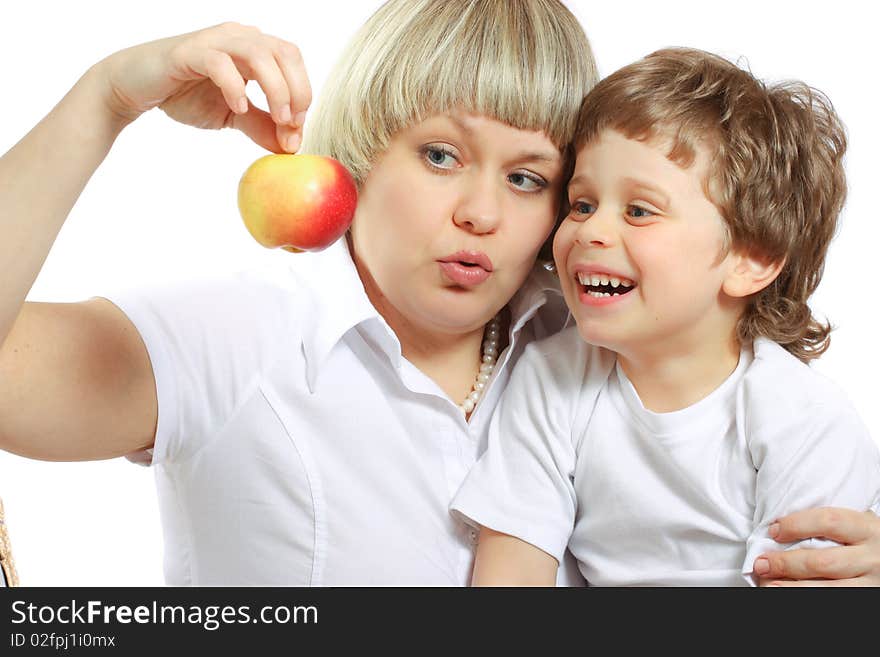 Woman and boy eating apple