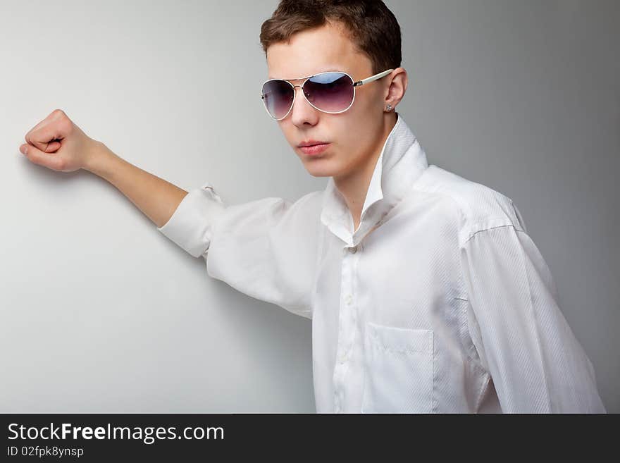 Portrait of young handsome man in sunglasses