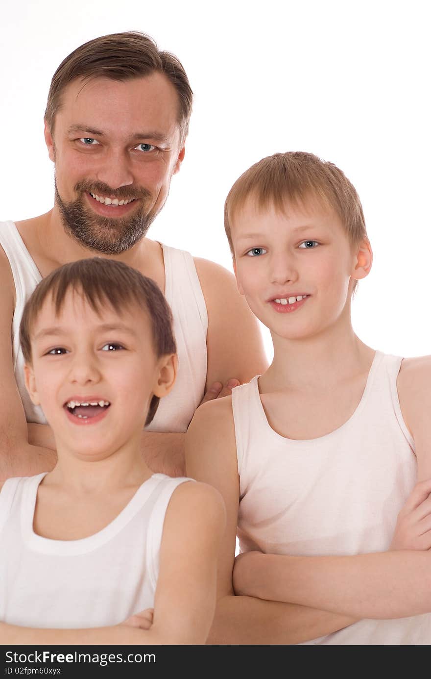 Young father with his two sons standing on a white background