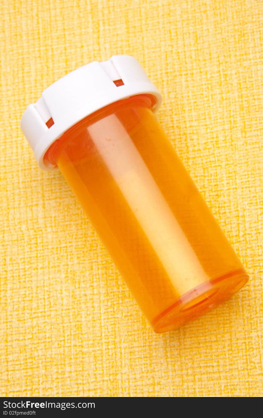 Prescription Bottle on Yellow