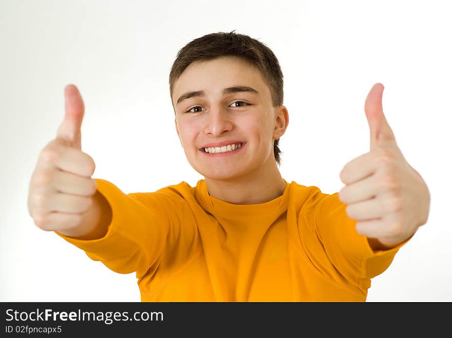 Handsome young man standing on a white