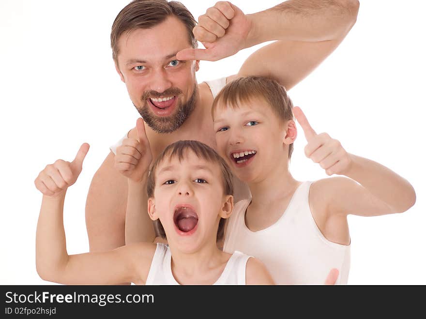 Young father with his two sons standing on a white background