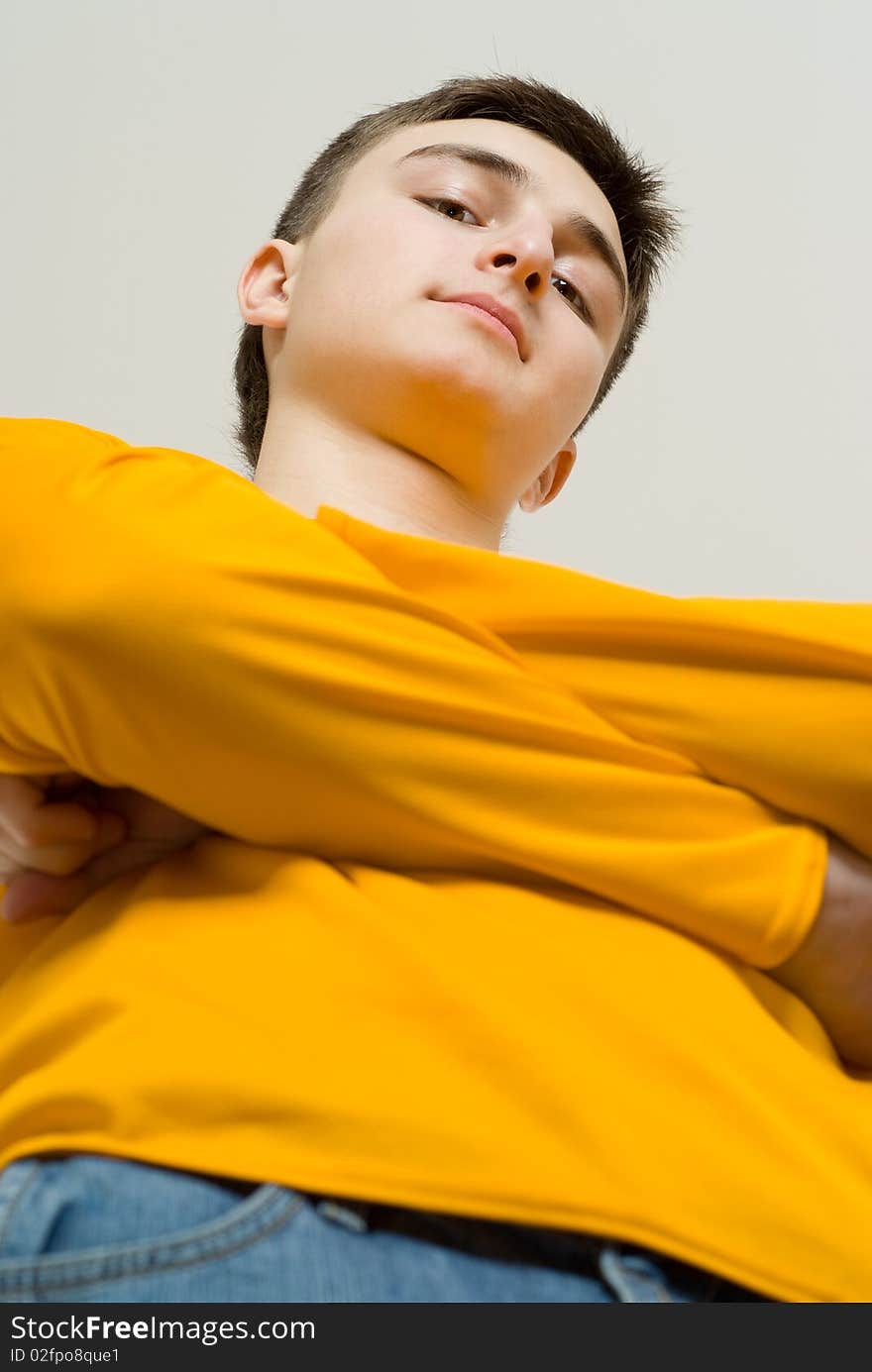 Beautiful young man standing on a white