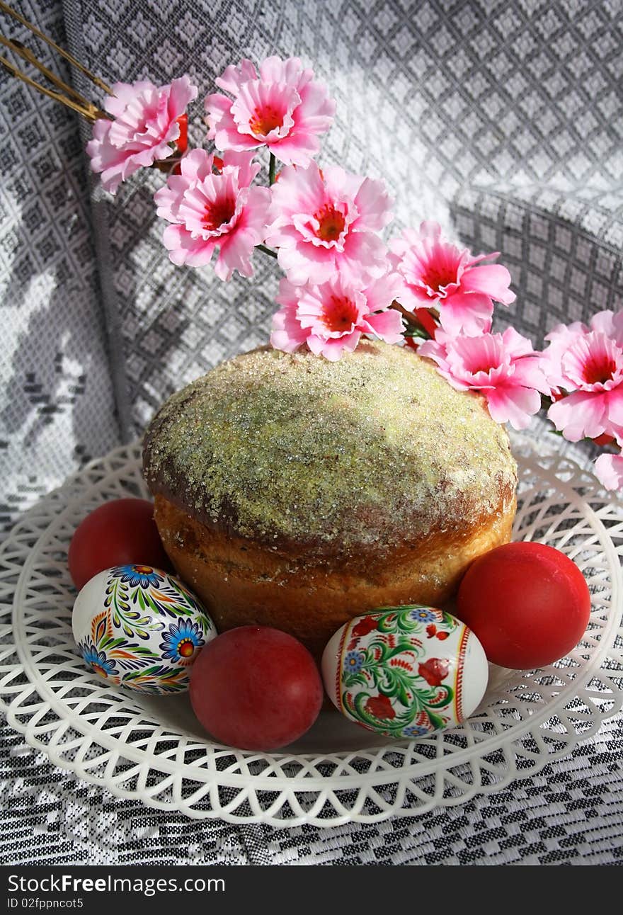 Traditional othodox easter pie with eggs on a ornamental cloth. Traditional othodox easter pie with eggs on a ornamental cloth