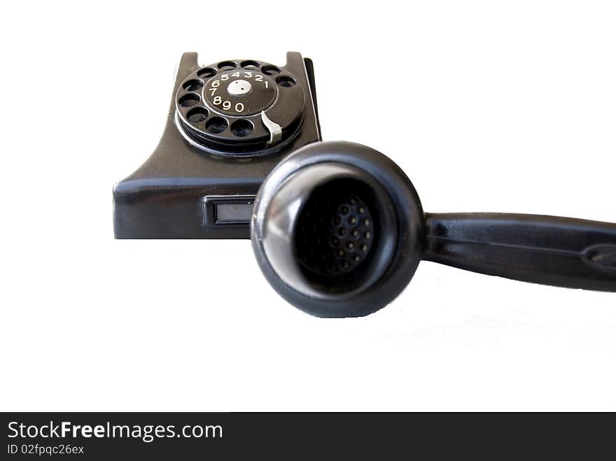 Black retro telephone on white