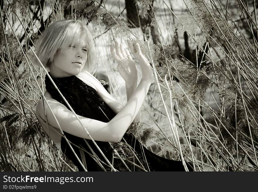 The girl makes the way through a grass. The girl makes the way through a grass