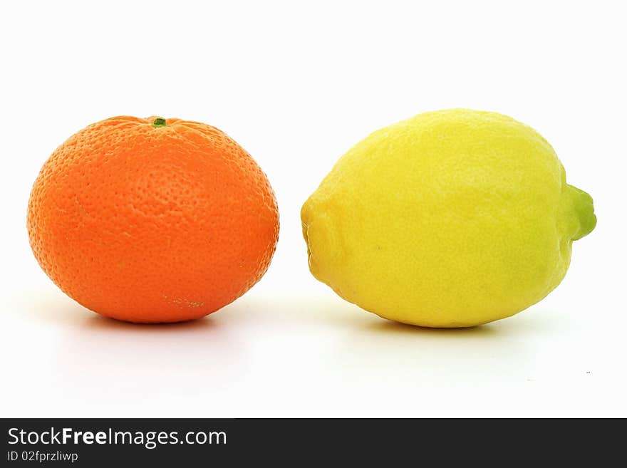 Delicious lemon and orange  fruits on a white background