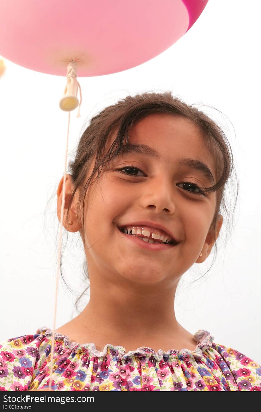 The joy of a little girl playing with balloons. The joy of a little girl playing with balloons