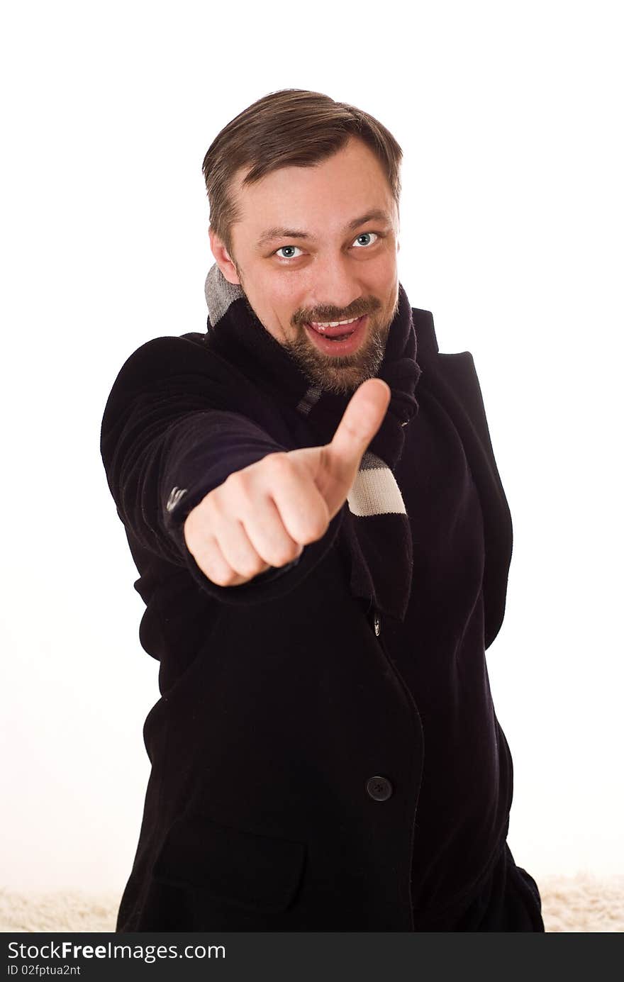 Happy man in a black coat with a white background