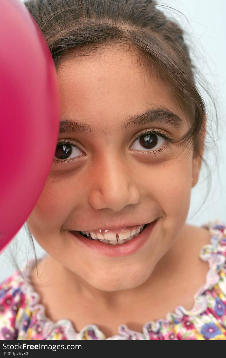 Living in the hands of a happy childhood with her balloons. Living in the hands of a happy childhood with her balloons