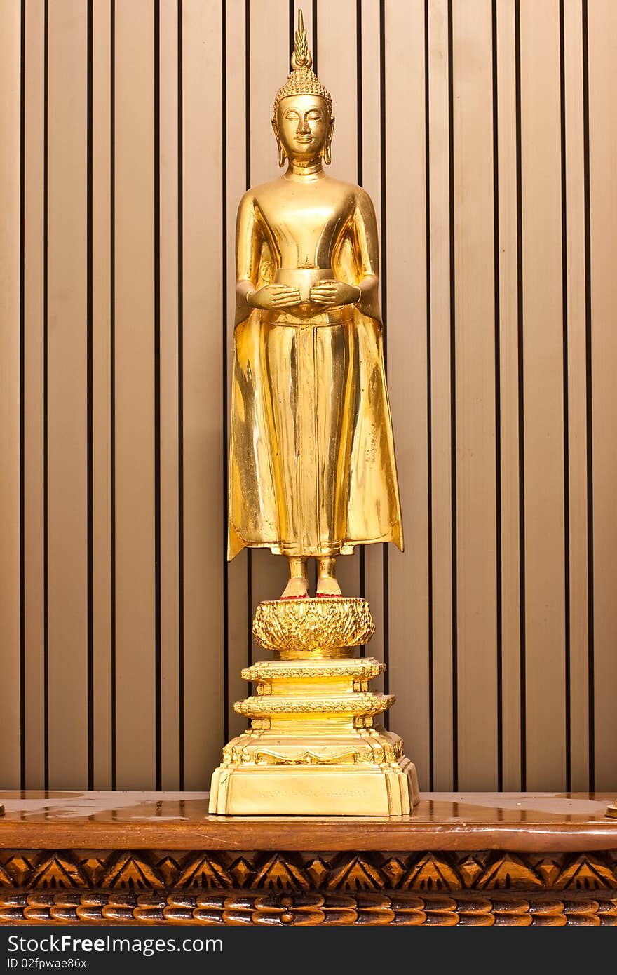 Golden Budha hold an alms bowl