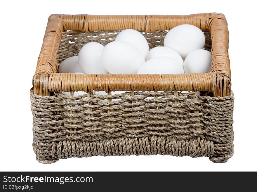 Basket with eggs it is isolated on a white background