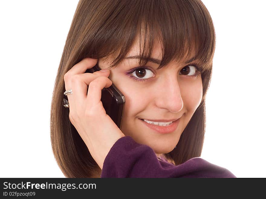 Young pretty girl with a phone on a white background