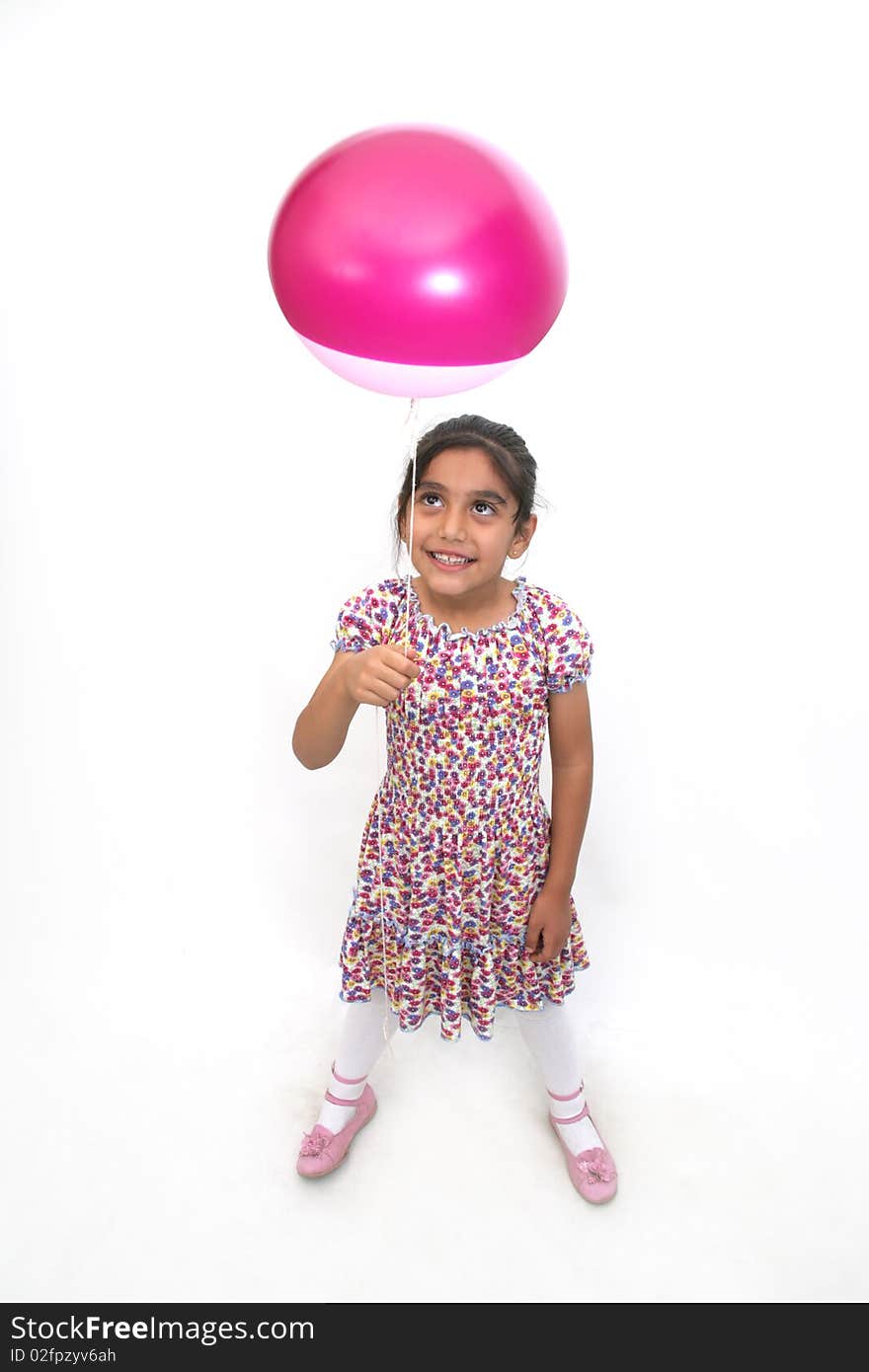 The joy of a little girl playing with balloons. The joy of a little girl playing with balloons