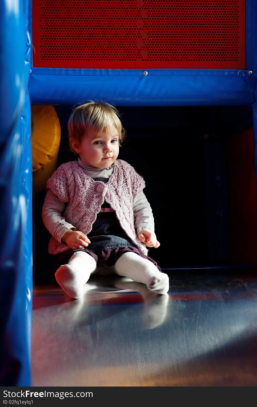 Young baby girl in indoor games