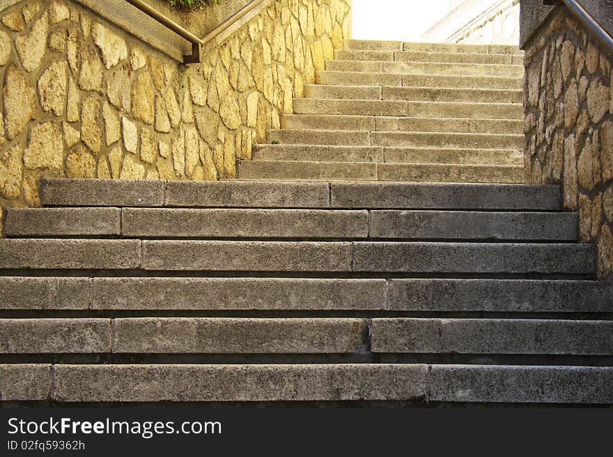 Old stone stair in a desolate alley. Old stone stair in a desolate alley.