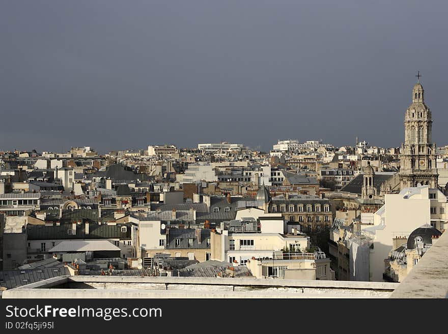 Dark sky and sunlight above paris. Dark sky and sunlight above paris