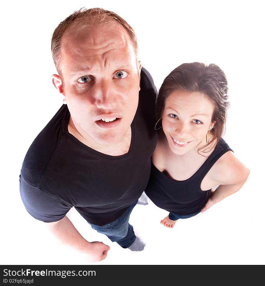 Young fresh couple looking up towards the camera. Happy and comfortable with each other.