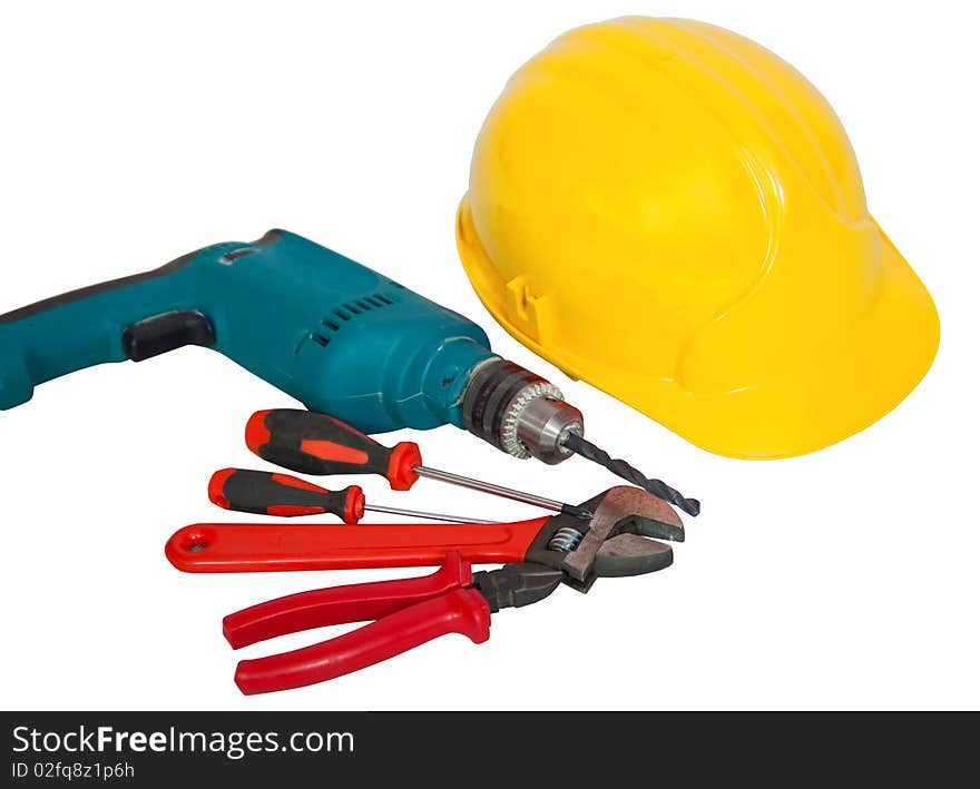 Hardhat, drill, screwdriver, turnscrew, wirecutter, spanner and wrench isolated on white. Hardhat, drill, screwdriver, turnscrew, wirecutter, spanner and wrench isolated on white