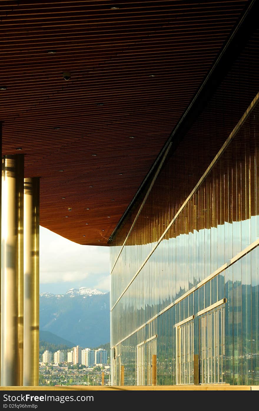 Glass wall of the Convention Center, Vancouver, BC. North Vancouver in the distance.