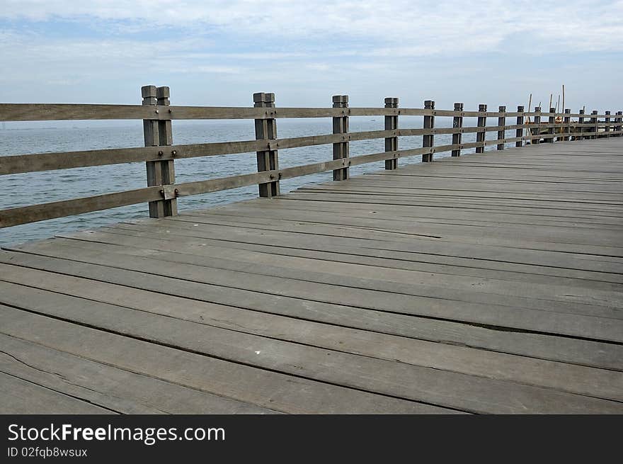 Wooden dock at the sea, located in Ancol, Indonesia