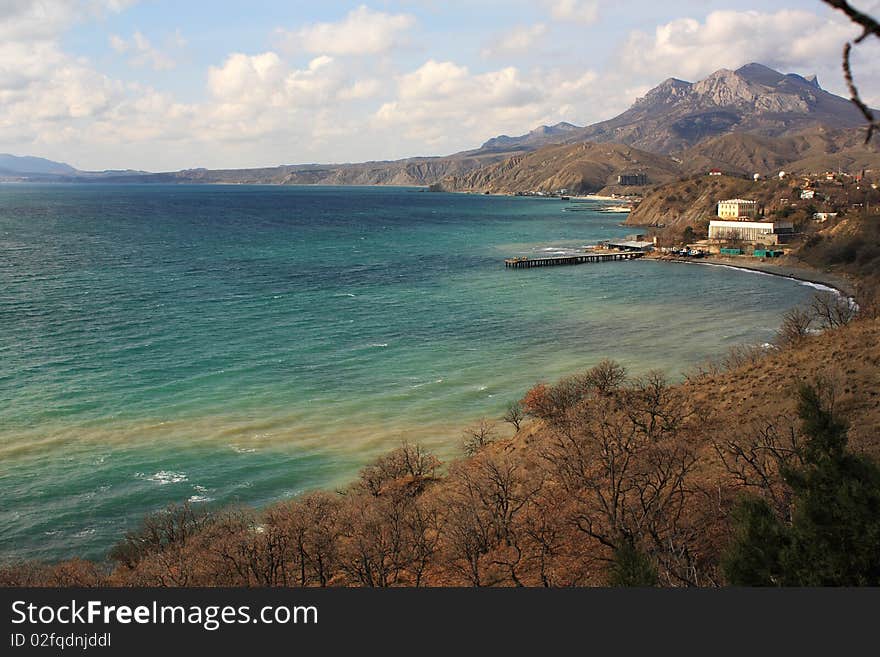 Sea view from the mountain slopes which are covered by forest. Sea view from the mountain slopes which are covered by forest.