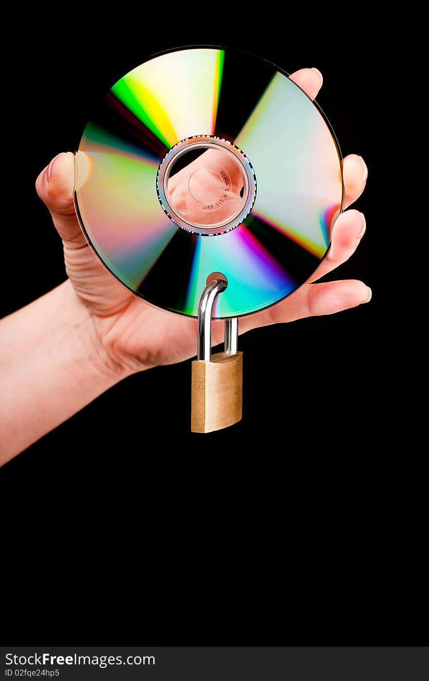 A hand holding a CD with a padlock on black background. A hand holding a CD with a padlock on black background