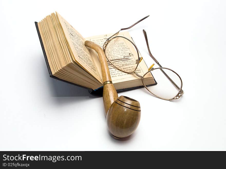 Brier, glasses and an opened book. Brier, glasses and an opened book