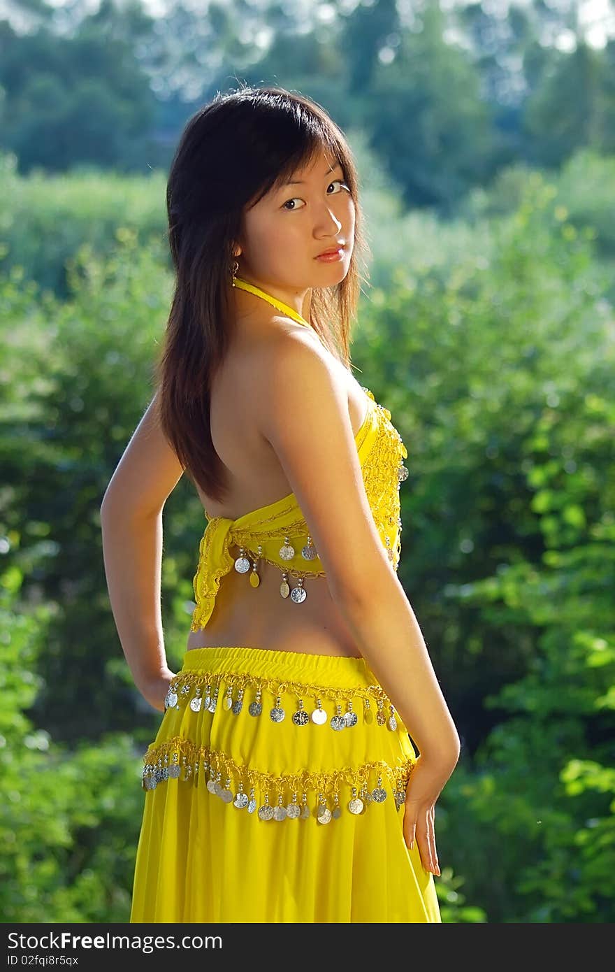 Pretty girl dancing in yellow indian dress. Pretty girl dancing in yellow indian dress