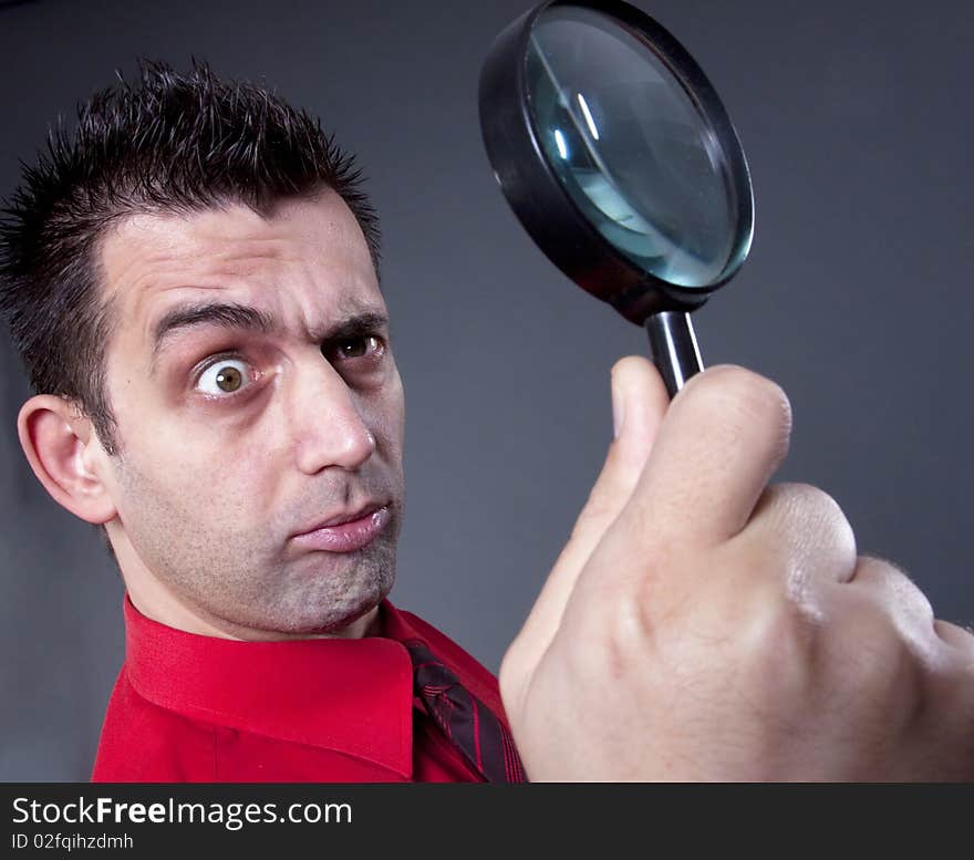 Businessman With Magnifying Glass