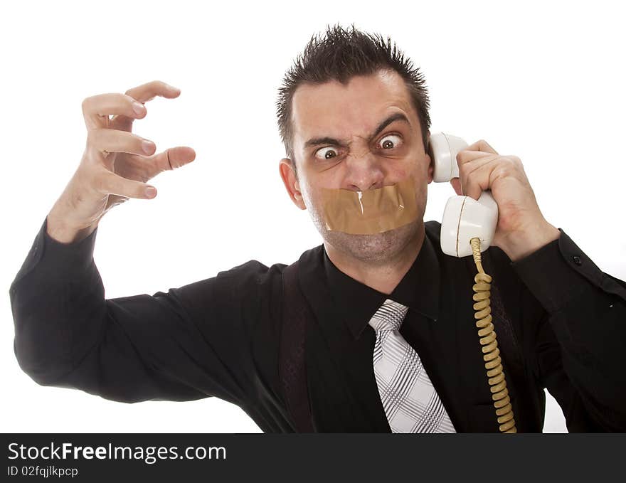 Funny businessman with tape on his mouth listening to someone on phone