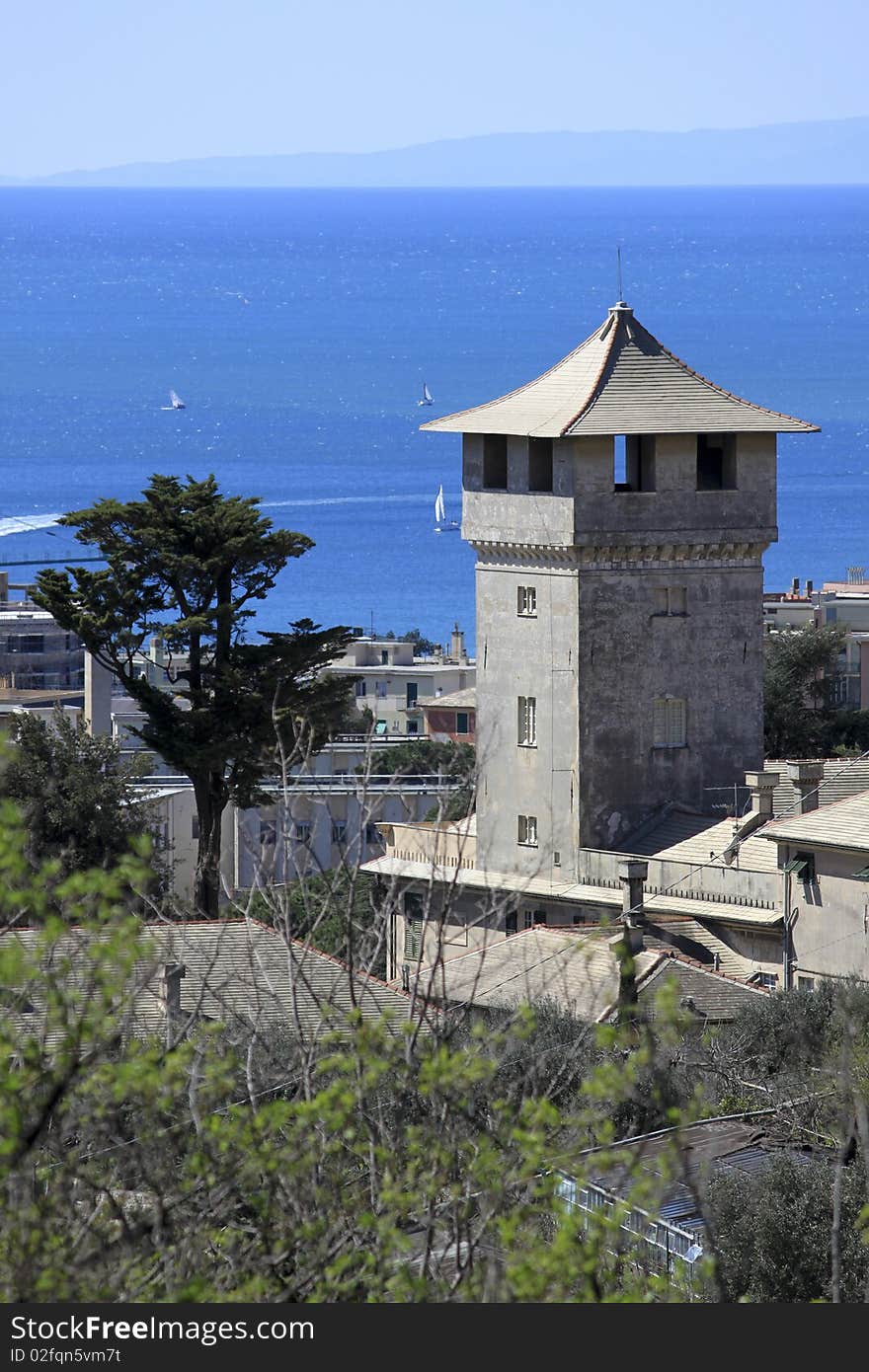 An old beautiful tower over a blue sea. An old beautiful tower over a blue sea.