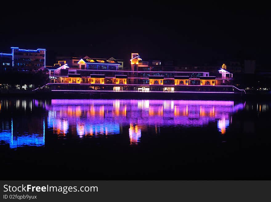 City by water at night in china.