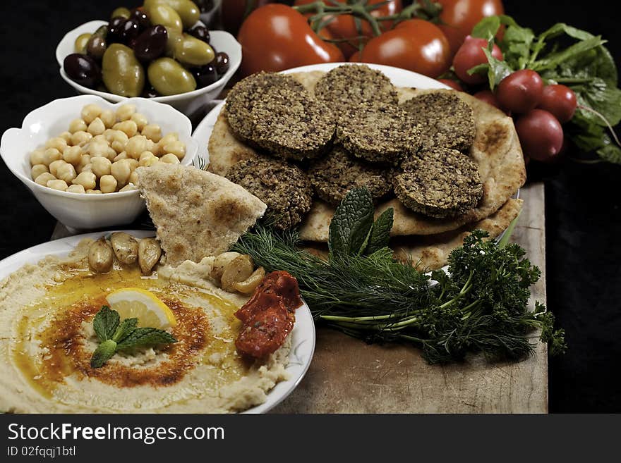 Humus and Falafels with chickpeas, radishes and tomatoes.