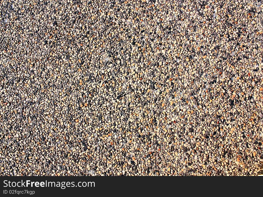 A small stone background texture of smooth stones.