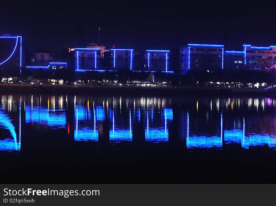 City by water at night in china.