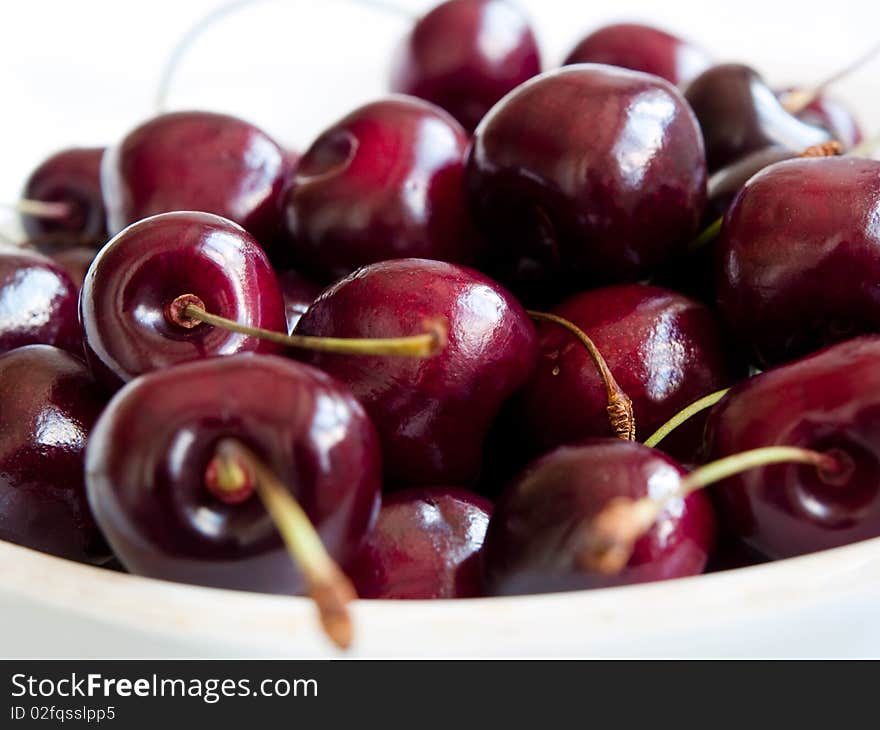 Ripe sweet cherry on a white background