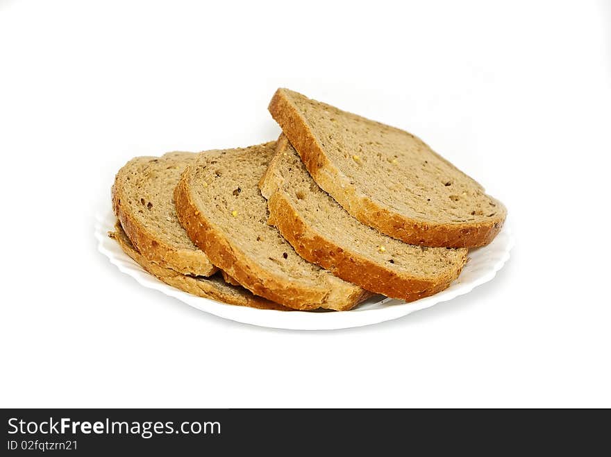 Pieces of bread on white plate