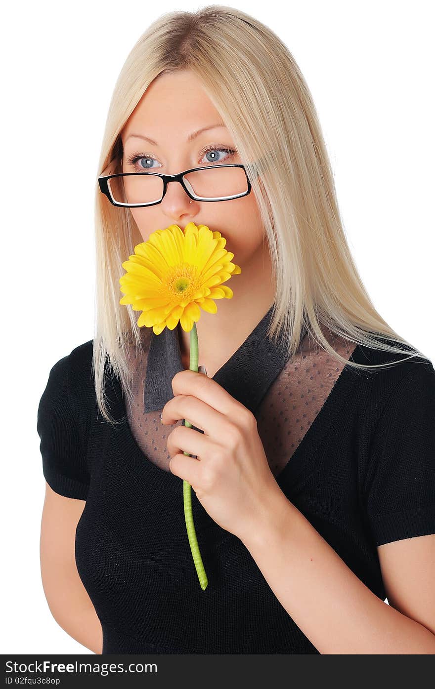 Charming young business woman with a yellow flower in the hands