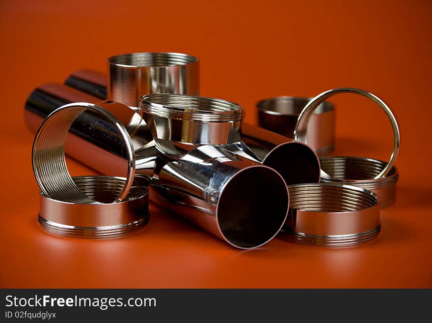 Steel chromium-plated rings with thread on a red background