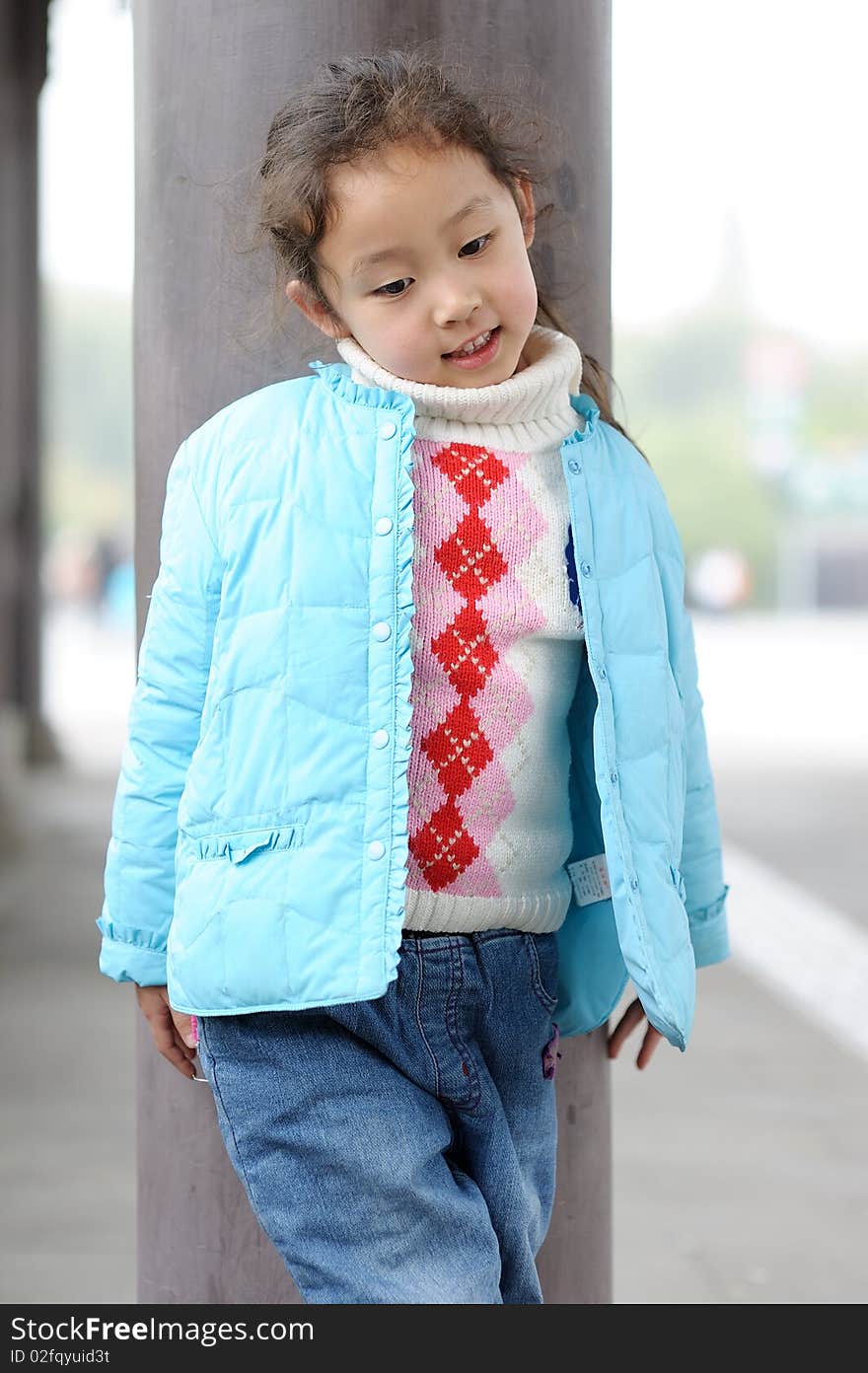 Cute little asian girl in blue.