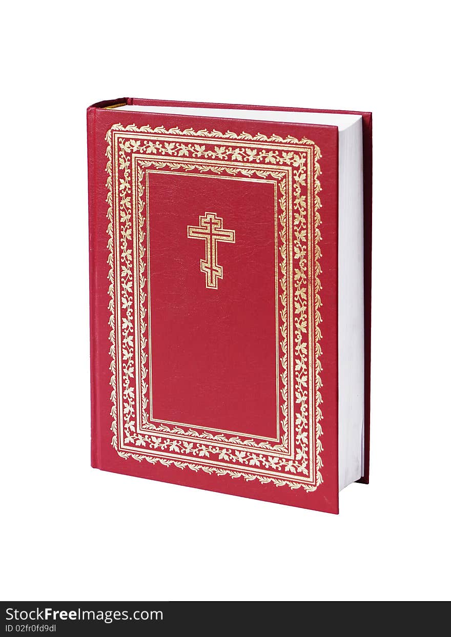 The big bible of red colour on a white background close up is isolated. The big bible of red colour on a white background close up is isolated