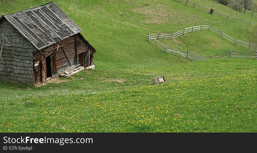 Deserted wooden house in the hills