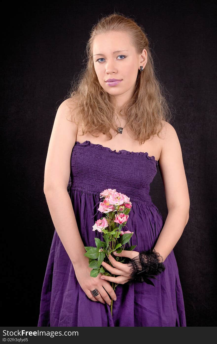 Portrait of a young girl with a flower roses. Portrait of a young girl with a flower roses