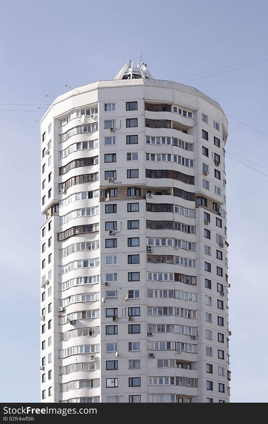 Tall house on a background of blue sky. Tall house on a background of blue sky