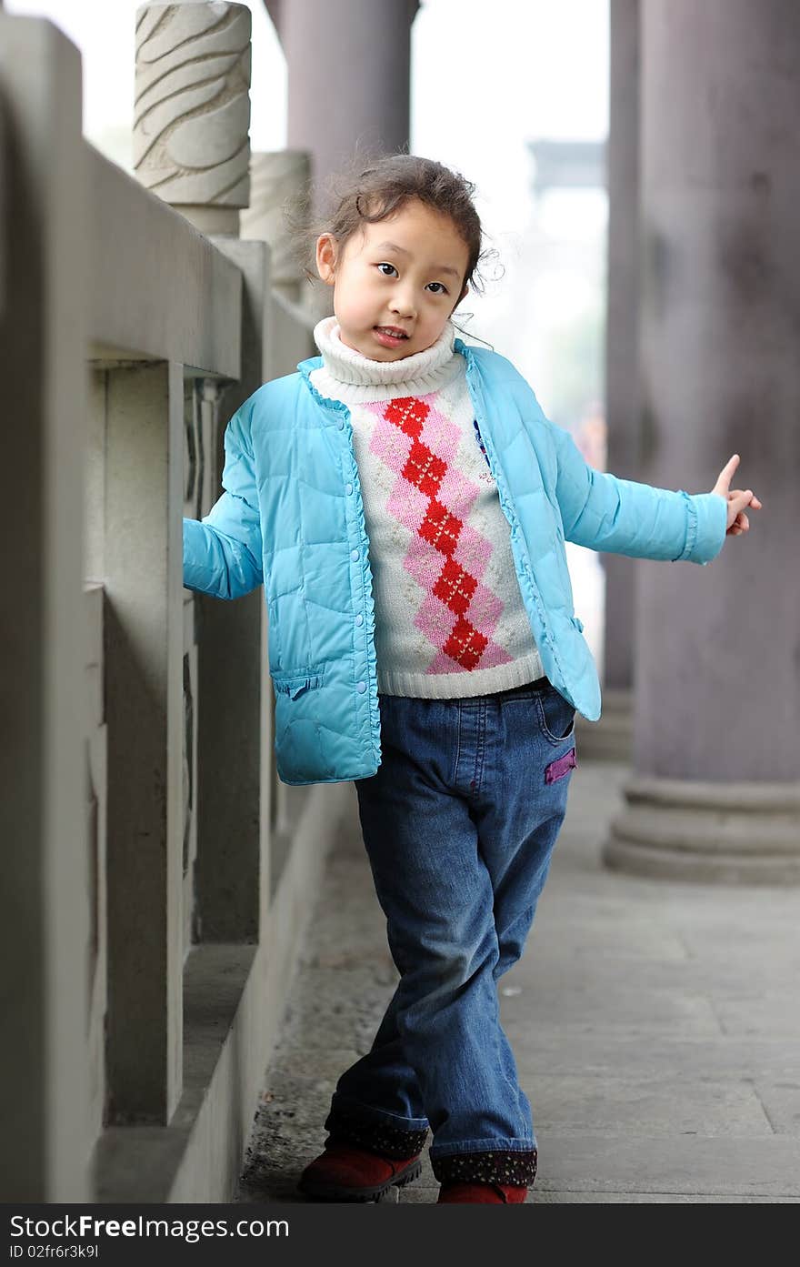 Cute little asian girl in blue.