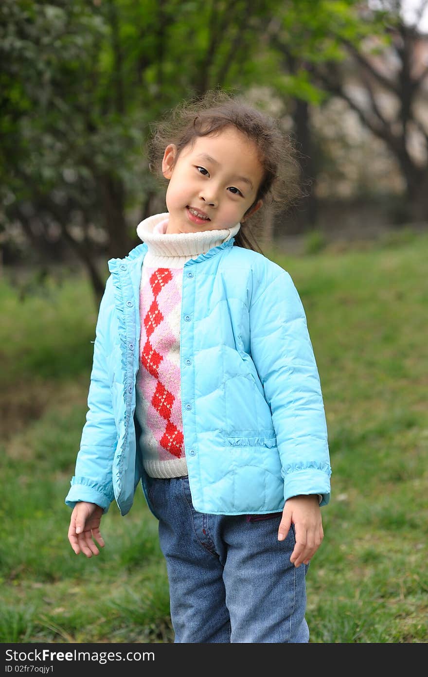 Cute Little Girl On Grass