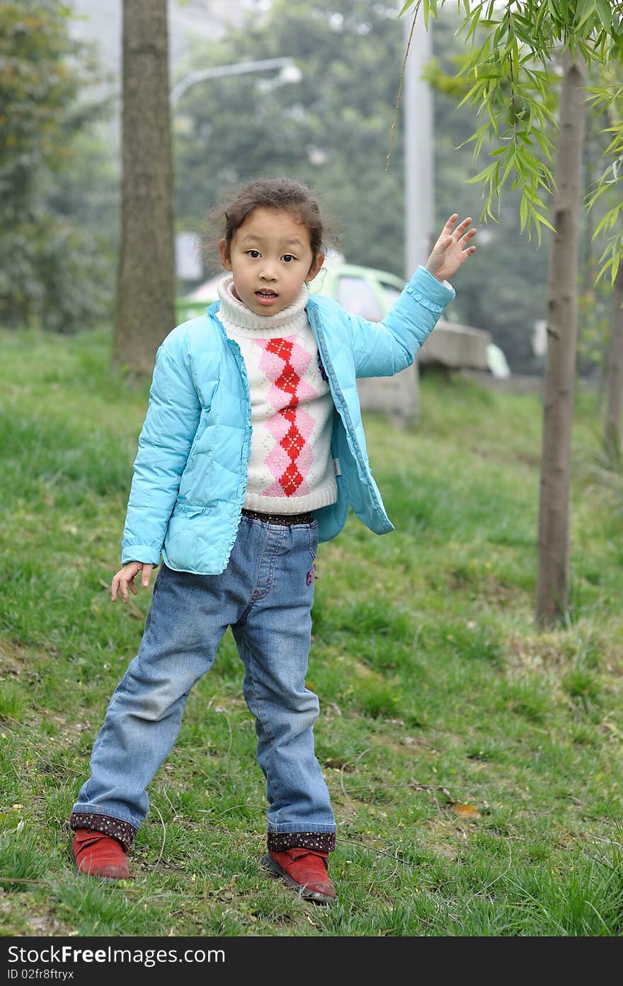 Cute Little Girl On Grass